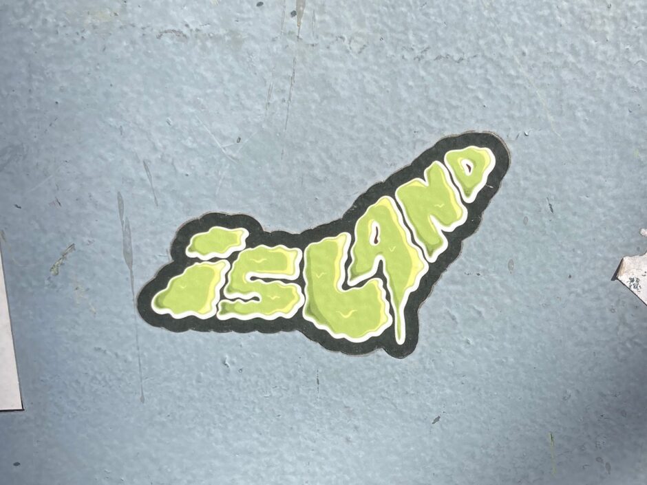 Sticker of the word island shaped like an island
