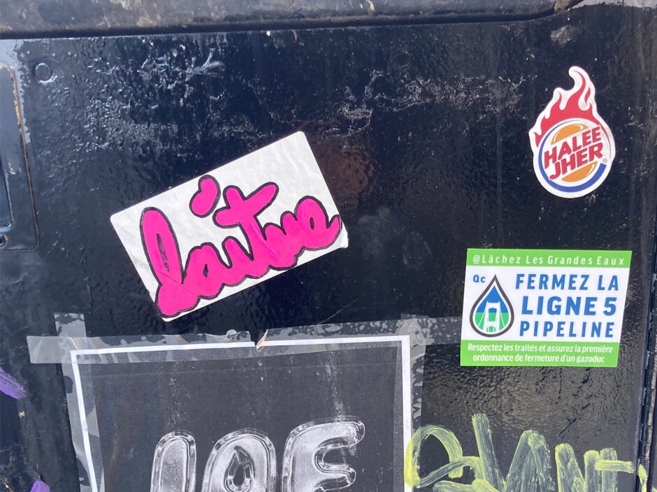 Random stickers on a post in Montreal