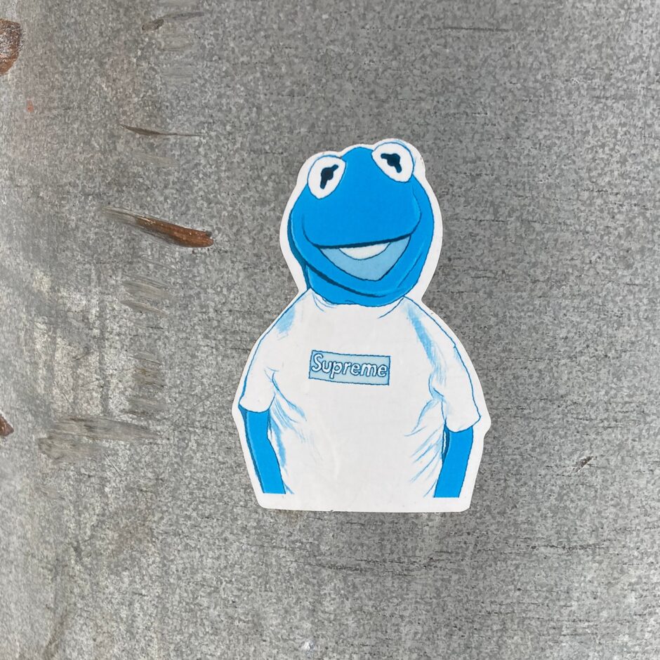 Sticker of Kermit the frog wearing a Supreme t-shirt