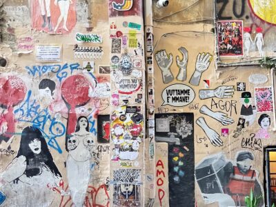 Wall covered with hundreds of stickers ranging many styles