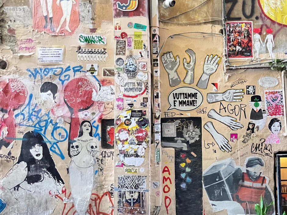 Wall covered with hundreds of stickers ranging many styles