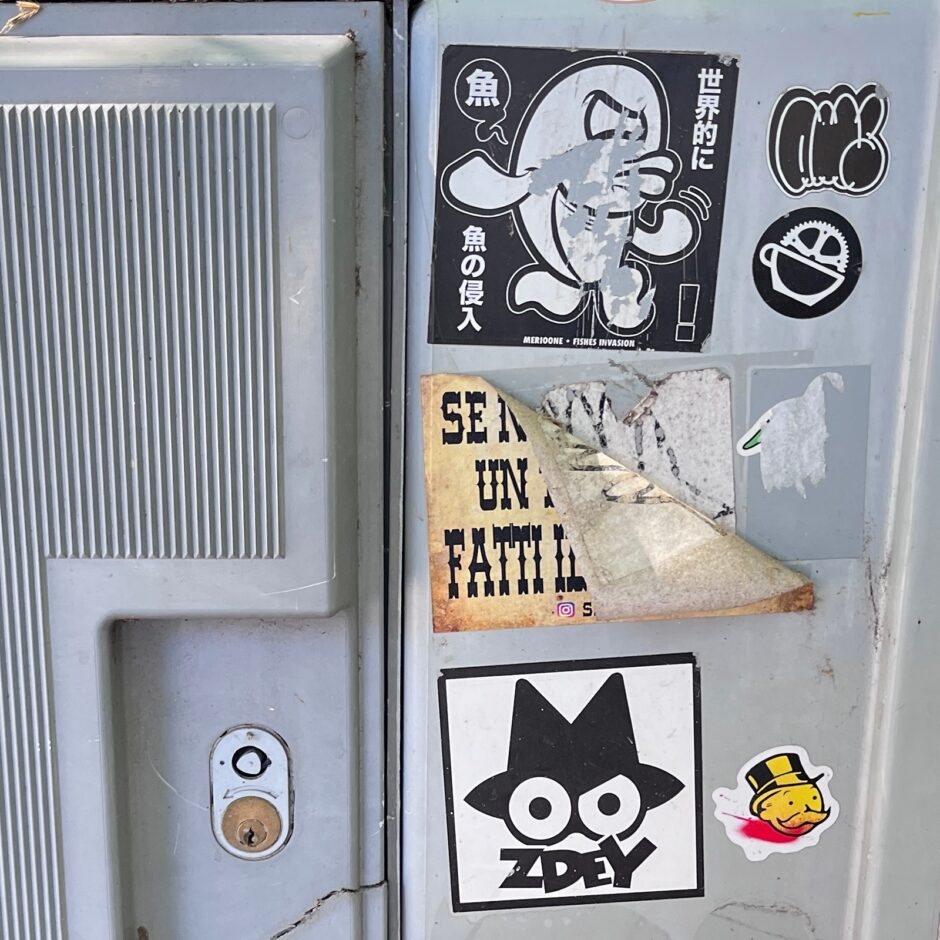 Sticker collage on electric box