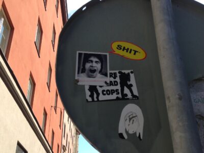 Collage of a man's face and a cartoon bubble containing the word shit