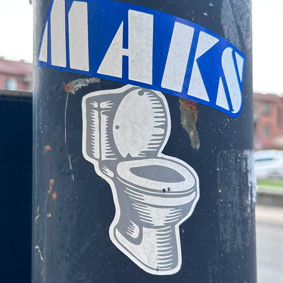 Toilet sticker on post