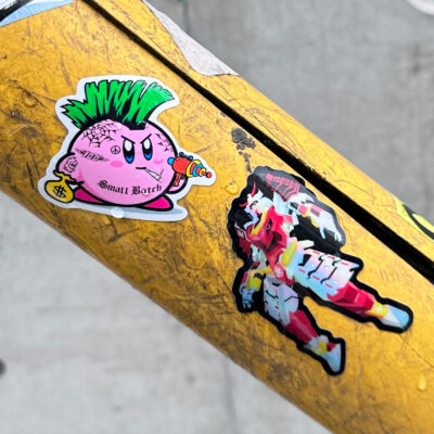 Quirby with a mohawk fighting a robot samurai