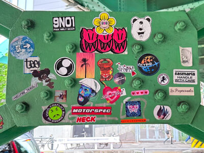 Stickers under a bridge