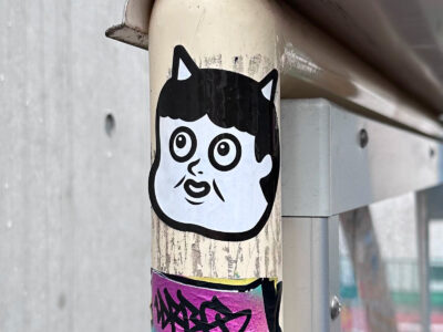 Childish devil face sticker