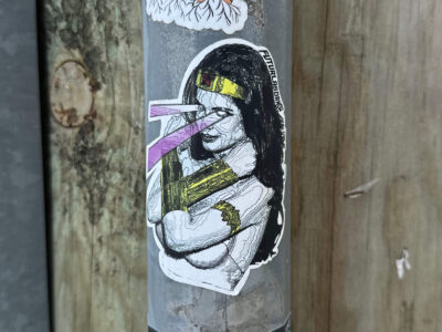 Sticker of a women with rays coming out of her eyes
