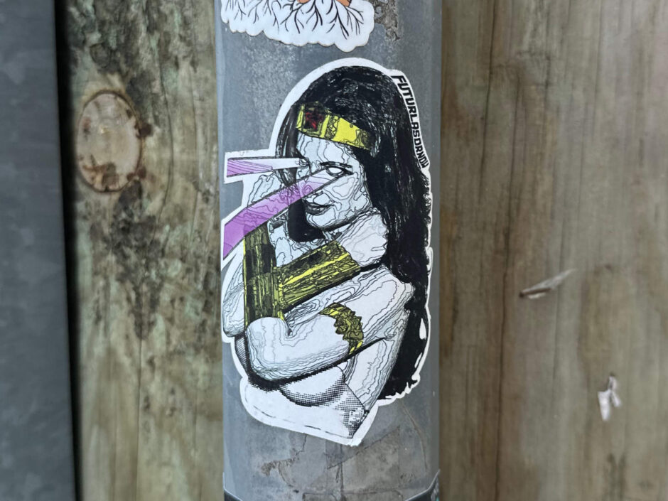 Sticker of a women with rays coming out of her eyes