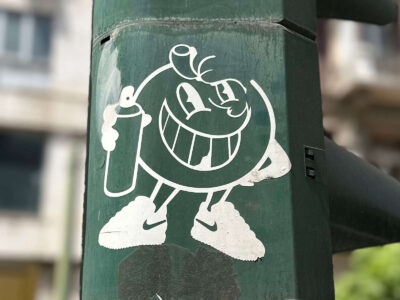 Smiley face with paint can sticker