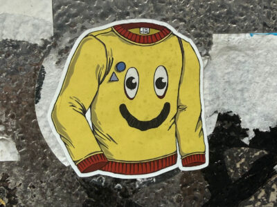 Smiling sweater sticker