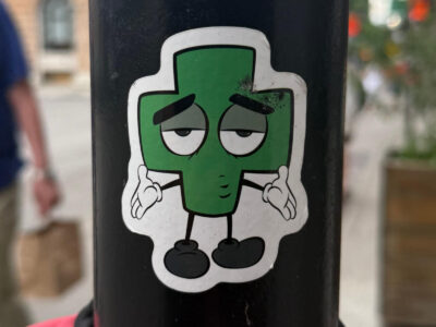 Green plus cartoon sticker